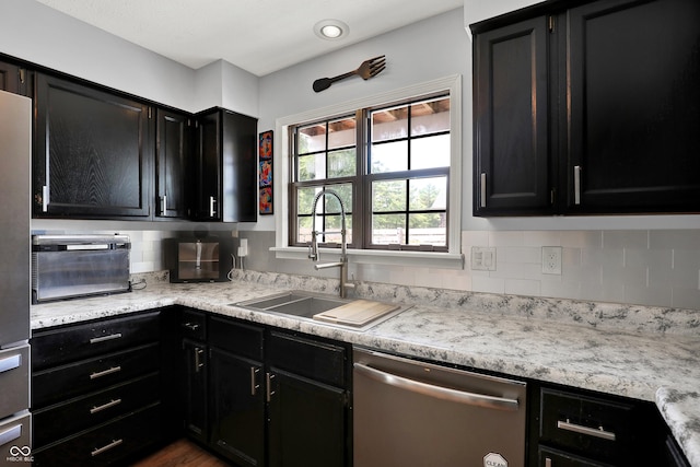 826 Royal Saint George Dr, Greenwood, IN 46143 - kitchen featuring dishwasher, dark cabinetry, tasteful backsplash, and light countertops