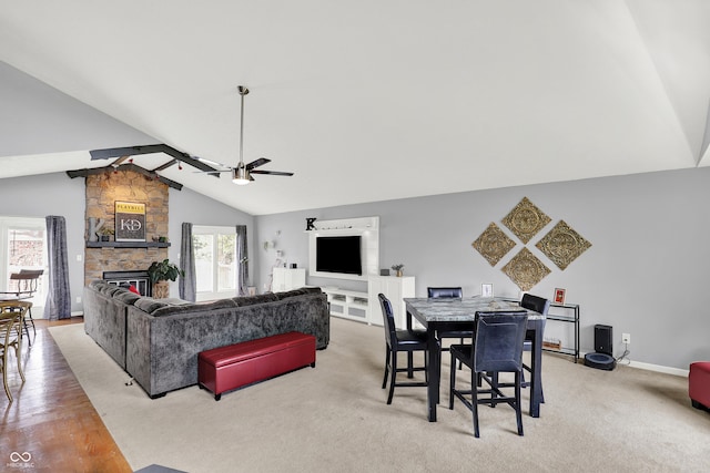 826 Royal Saint George Dr, Greenwood, IN 46143 - living room featuring lofted ceiling, a ceiling fan, a fireplace, and light carpet