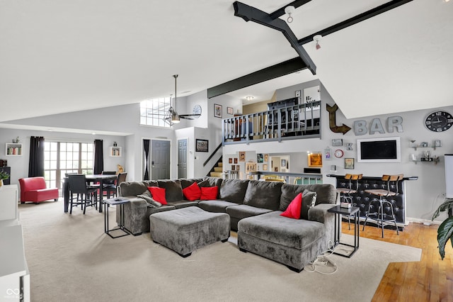 826 Royal Saint George Dr, Greenwood, IN 46143 - living area with stairway, high vaulted ceiling, a chandelier, and wood finished floors