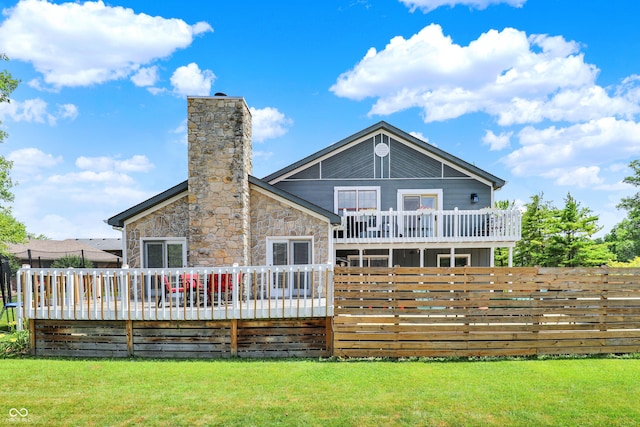 826 Royal Saint George Dr, Greenwood, IN 46143 - rear view of house with a wooden deck, a chimney, and stone siding