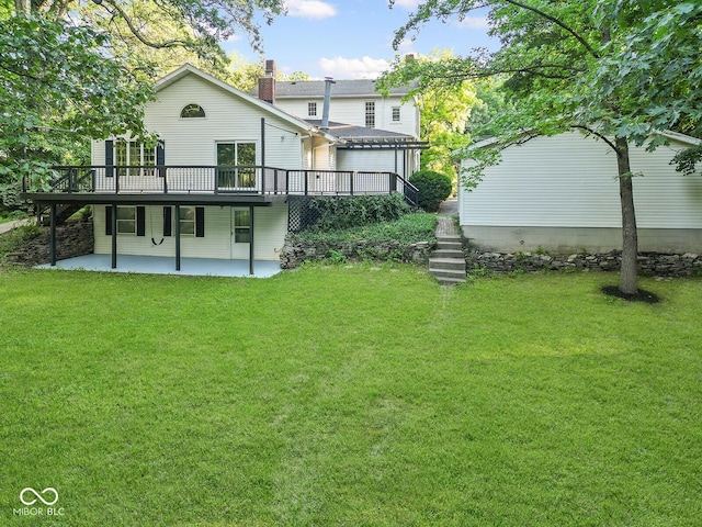 2131 Union St, Lafayette, IN 47904 - back of property featuring a patio area, a deck, a yard, and a chimney
