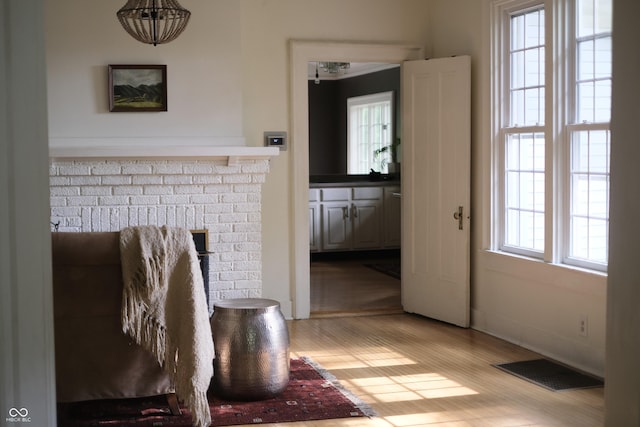2131 Union St, Lafayette, IN 47904 - living room featuring light wood-style floors and a brick fireplace