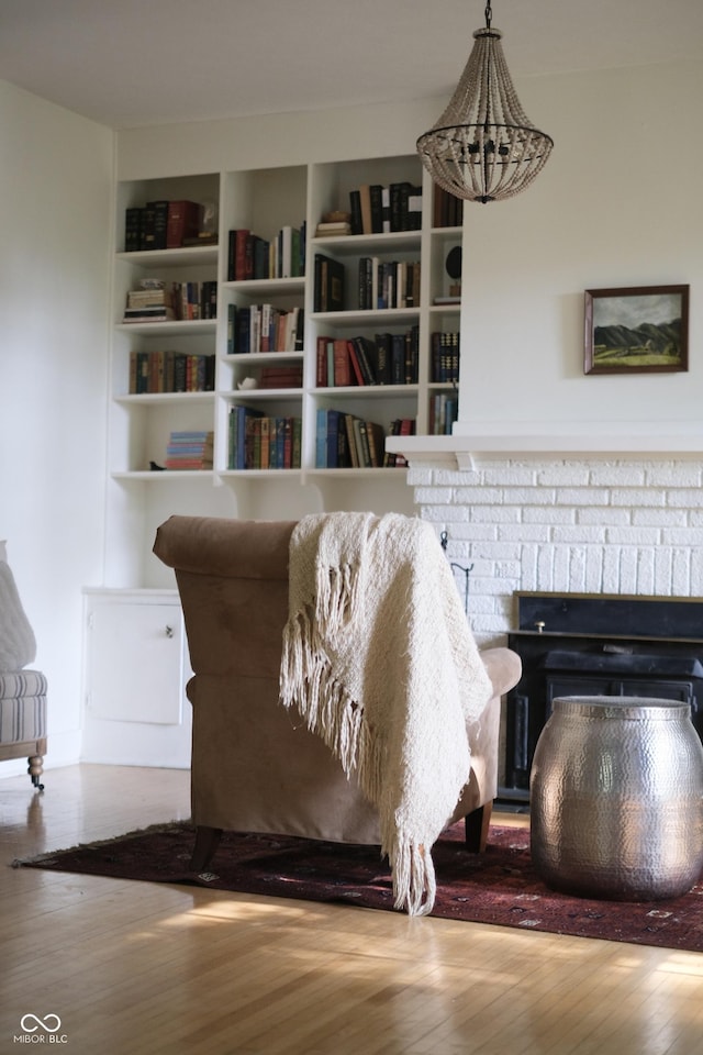 2131 Union St, Lafayette, IN 47904 - living area with wood finished floors, a brick fireplace, and built in shelves
