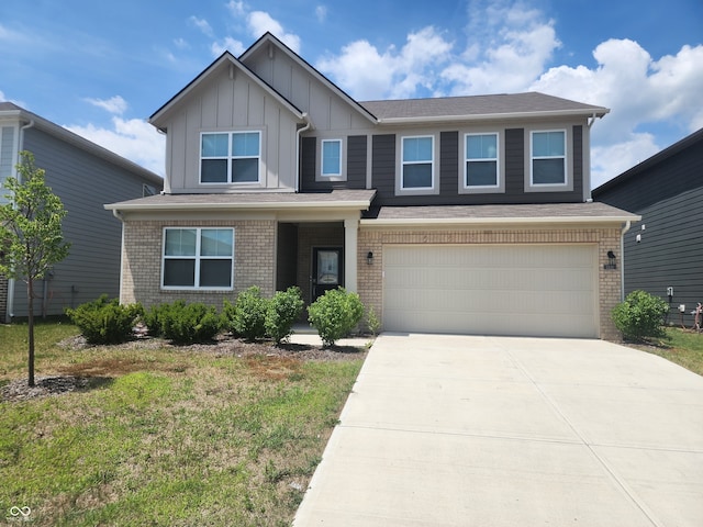 2431 S Carlota Dr, New Palestine, IN 46163 - craftsman-style house with board and batten siding, driveway, a garage, and brick siding