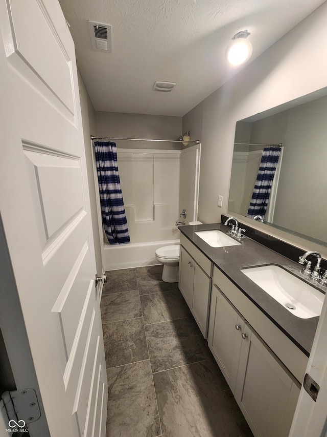 2431 S Carlota Dr, New Palestine, IN 46163 - bathroom featuring double vanity, shower / tub combo with curtain, and stone finish flooring