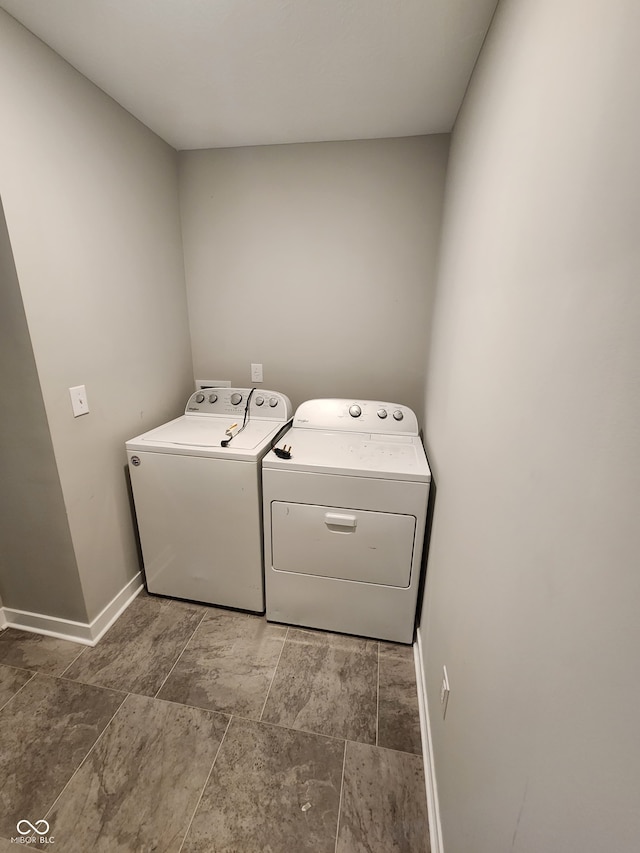 2431 S Carlota Dr, New Palestine, IN 46163 - washroom featuring washing machine and dryer and baseboards