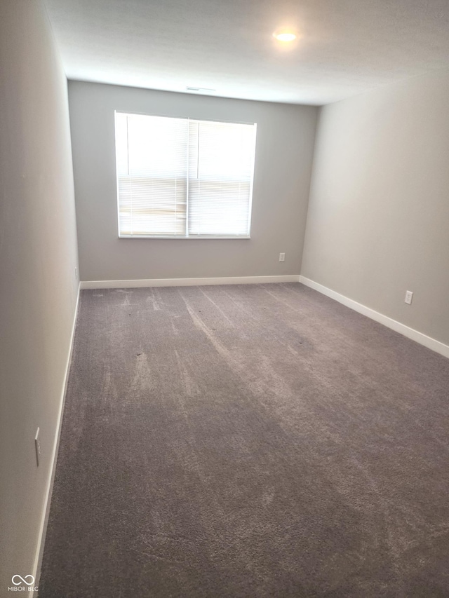 2431 S Carlota Dr, New Palestine, IN 46163 - carpeted empty room with baseboards