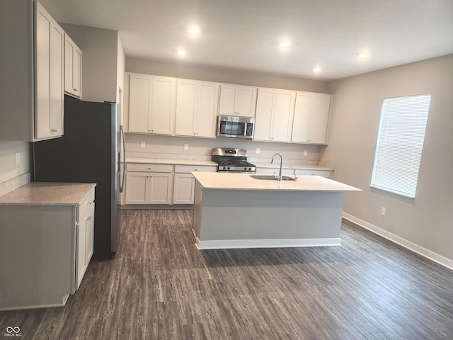 2431 S Carlota Dr, New Palestine, IN 46163 - kitchen with stainless steel appliances, dark wood-style flooring, white cabinetry, a kitchen island with sink, and recessed lighting
