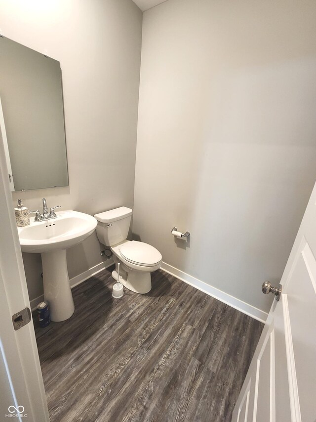 2431 S Carlota Dr, New Palestine, IN 46163 - half bath with toilet and wood finished floors