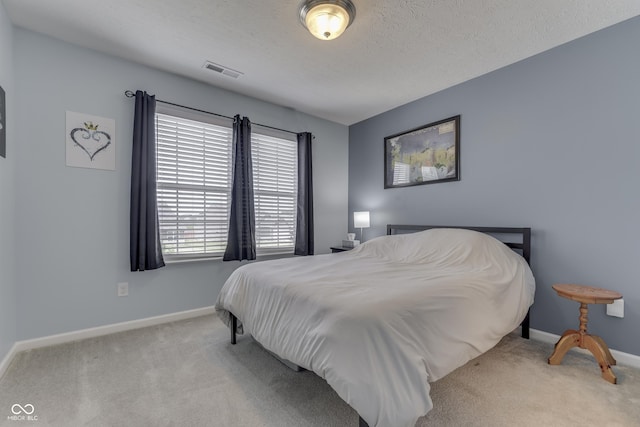 12291 Falling Leaves Trl, Indianapolis, IN 46229 - bedroom with carpet floors and a textured ceiling