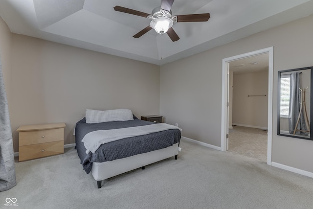 12291 Falling Leaves Trl, Indianapolis, IN 46229 - carpeted bedroom featuring a raised ceiling and a ceiling fan