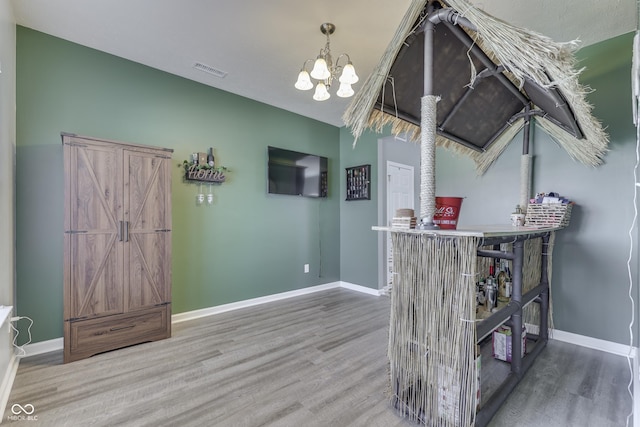 12291 Falling Leaves Trl, Indianapolis, IN 46229 - interior space with wood finished floors and a chandelier