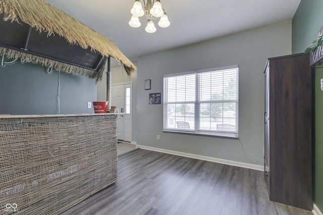 12291 Falling Leaves Trl, Indianapolis, IN 46229 - unfurnished living room with wood finished floors and a chandelier
