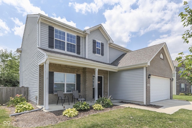 12291 Falling Leaves Trl, Indianapolis, IN 46229 - traditional-style house with covered porch, brick siding, an attached garage, and driveway