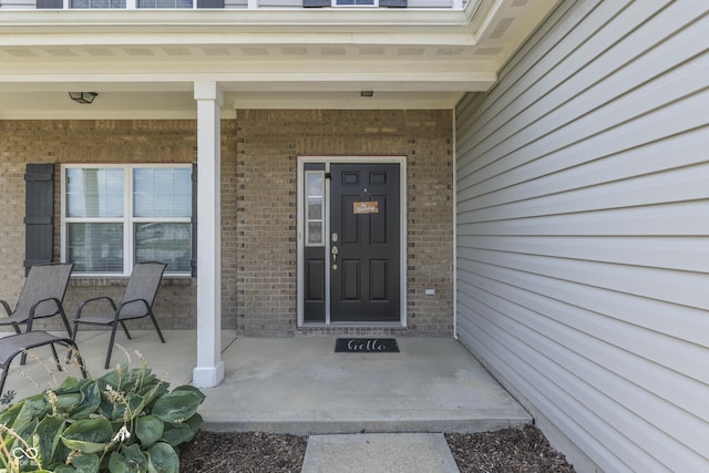 12291 Falling Leaves Trl, Indianapolis, IN 46229 - entrance to property featuring covered porch and brick siding