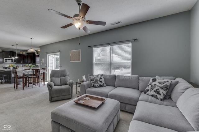 12291 Falling Leaves Trl, Indianapolis, IN 46229 - living area featuring a ceiling fan and light carpet