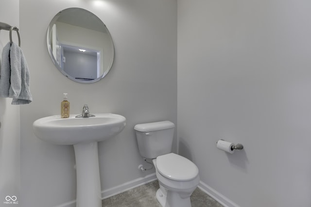 12291 Falling Leaves Trl, Indianapolis, IN 46229 - bathroom featuring toilet and baseboards