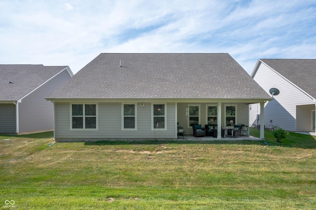 2584 Lanai Ln, Greenwood, IN 46143 - back of property with an outdoor living space, a patio area, roof with shingles, and a yard