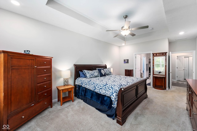 2584 Lanai Ln, Greenwood, IN 46143 - bedroom featuring light carpet, a tray ceiling, recessed lighting, and a ceiling fan