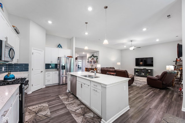 2584 Lanai Ln, Greenwood, IN 46143 - kitchen featuring stainless steel appliances, dark wood-style floors, open floor plan, backsplash, and recessed lighting