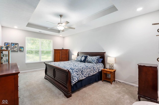2584 Lanai Ln, Greenwood, IN 46143 - bedroom with a raised ceiling, light colored carpet, recessed lighting, and a ceiling fan
