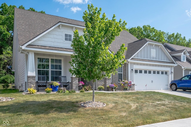 2584 Lanai Ln, Greenwood, IN 46143 - craftsman house featuring roof with shingles, a porch, a garage, and a front lawn