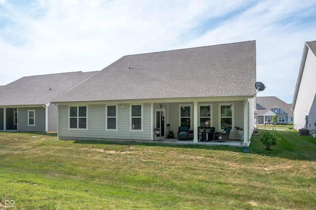 2584 Lanai Ln, Greenwood, IN 46143 - rear view of house featuring a patio area, a lawn, and a shingled roof