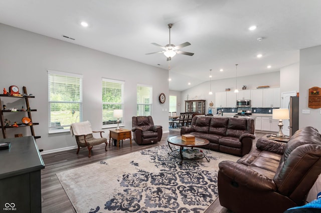2584 Lanai Ln, Greenwood, IN 46143 - living room with dark wood-type flooring, a ceiling fan, vaulted ceiling, and recessed lighting