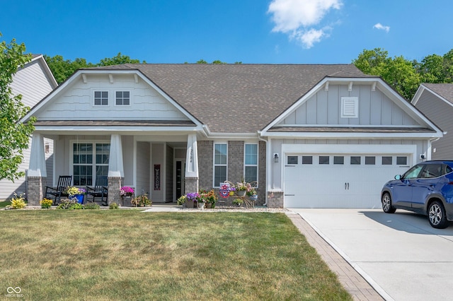 2584 Lanai Ln, Greenwood, IN 46143 - craftsman house with a garage, board and batten siding, driveway, roof with shingles, and a front yard