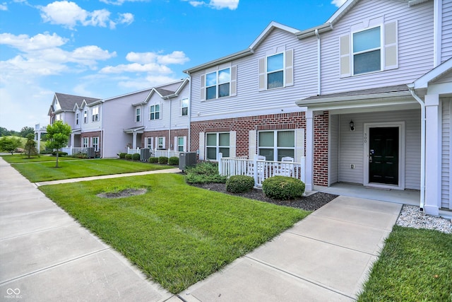 12075 Scoria Dr Unit 500, Fishers, IN 46038 - view of property featuring a residential view, brick siding, and a front yard
