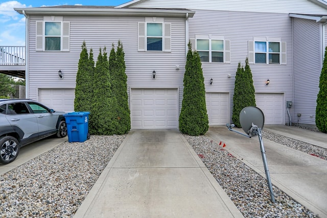 12075 Scoria Dr Unit 500, Fishers, IN 46038 - view of home's exterior with an attached garage and concrete driveway