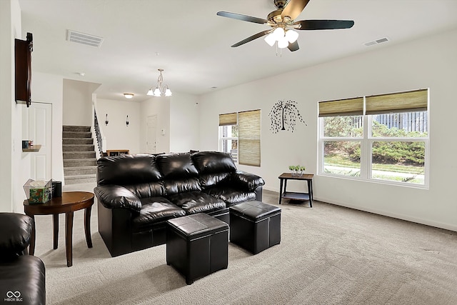 12075 Scoria Dr Unit 500, Fishers, IN 46038 - living room with light colored carpet, a ceiling fan, stairway, and a chandelier