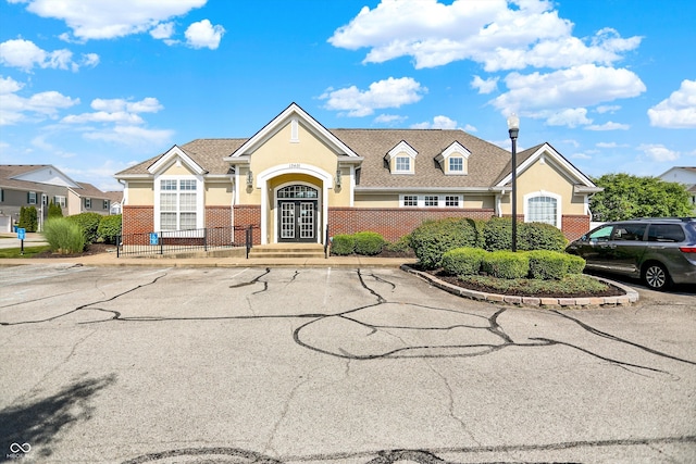12075 Scoria Dr Unit 500, Fishers, IN 46038 - traditional-style home featuring uncovered parking, stucco siding, and brick siding