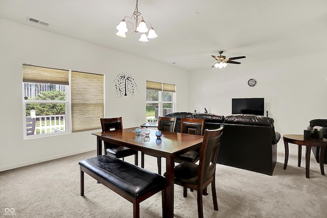 12075 Scoria Dr Unit 500, Fishers, IN 46038 - dining room featuring light colored carpet, a chandelier, and a ceiling fan