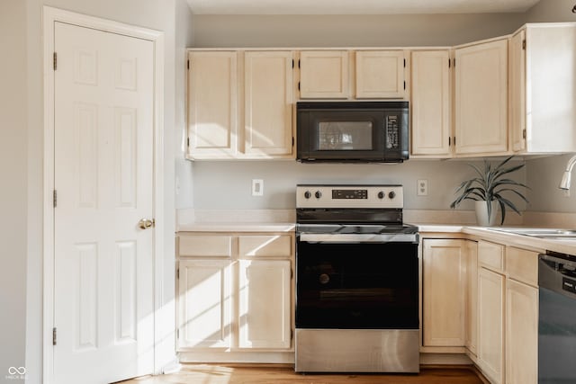 3923 N Bressingham Dr, Indianapolis, IN 46235 - kitchen featuring black microwave, stainless steel range with electric cooktop, dishwashing machine, light countertops, and light brown cabinets