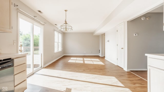 3923 N Bressingham Dr, Indianapolis, IN 46235 - unfurnished dining area with a chandelier and light wood finished floors
