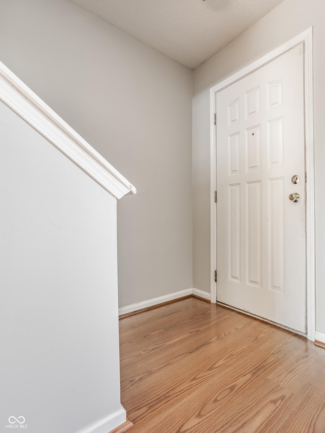 3923 N Bressingham Dr, Indianapolis, IN 46235 - foyer featuring light wood-style floors and baseboards