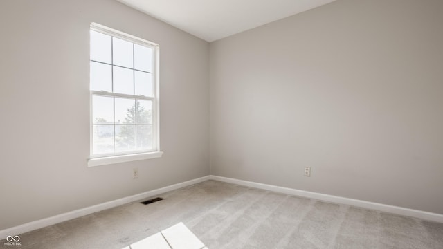 3923 N Bressingham Dr, Indianapolis, IN 46235 - empty room featuring light carpet and plenty of natural light