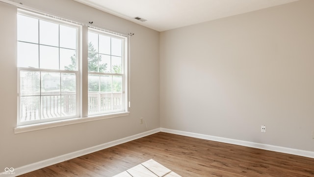 3923 N Bressingham Dr, Indianapolis, IN 46235 - unfurnished room with healthy amount of natural light and wood finished floors