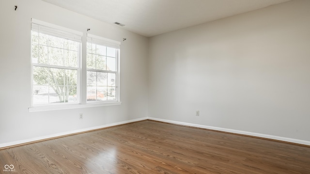 3923 N Bressingham Dr, Indianapolis, IN 46235 - unfurnished room featuring wood finished floors and baseboards