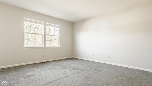 3923 N Bressingham Dr, Indianapolis, IN 46235 - carpeted spare room with baseboards and a textured ceiling