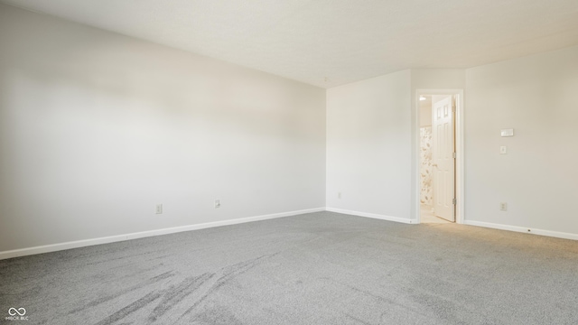 3923 N Bressingham Dr, Indianapolis, IN 46235 - spare room featuring carpet and baseboards