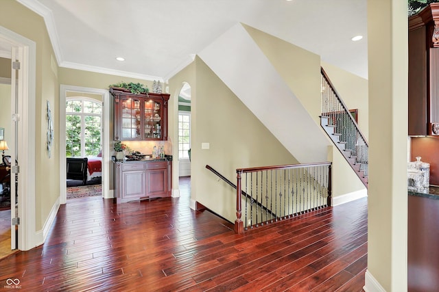 523 S 700 E, Whitestown, IN 46075 - foyer featuring dark wood-style floors, crown molding, arched walkways, and recessed lighting