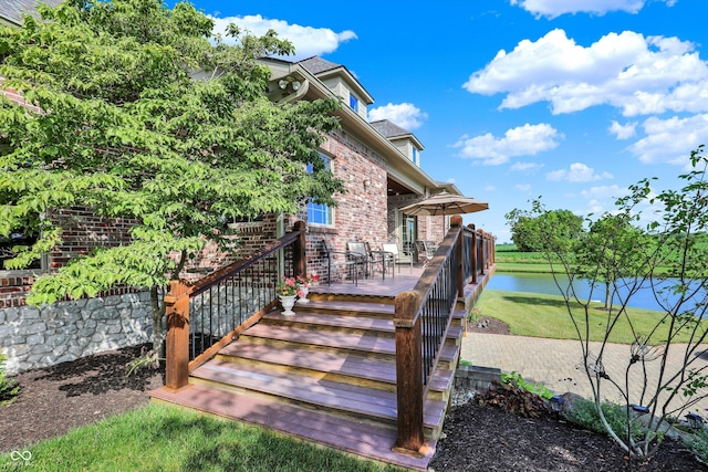 523 S 700 E, Whitestown, IN 46075 - property entrance with brick siding, a yard, and a deck with water view