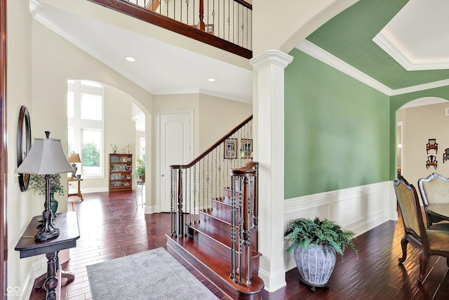 523 S 700 E, Whitestown, IN 46075 - staircase featuring hardwood / wood-style flooring, arched walkways, a high ceiling, wainscoting, and ornamental molding