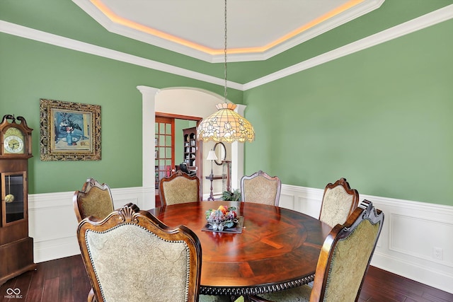 523 S 700 E, Whitestown, IN 46075 - dining room featuring a wainscoted wall, ornate columns, dark wood finished floors, a raised ceiling, and ornamental molding