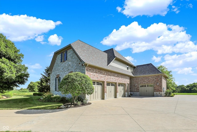 523 S 700 E, Whitestown, IN 46075 - view of home's exterior featuring driveway, a yard, stone siding, brick siding, and roof with shingles