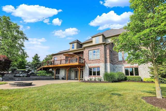 523 S 700 E, Whitestown, IN 46075 - back of property featuring stone siding, a yard, a deck, and a patio