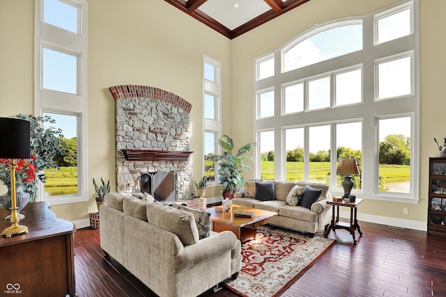 523 S 700 E, Whitestown, IN 46075 - living area featuring a towering ceiling, a stone fireplace, dark wood-type flooring, coffered ceiling, and beam ceiling