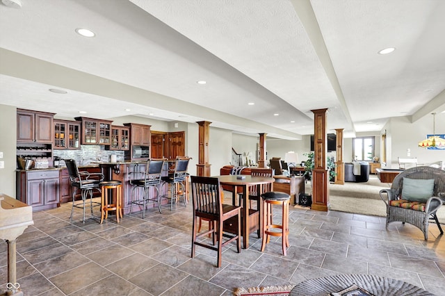 523 S 700 E, Whitestown, IN 46075 - dining space featuring decorative columns, recessed lighting, and bar area